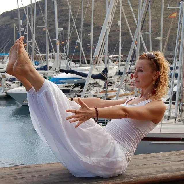 Boat pose (navasana) in a harbour