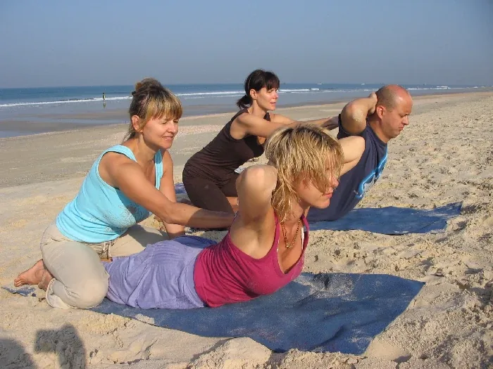 Group practice on a beach in India